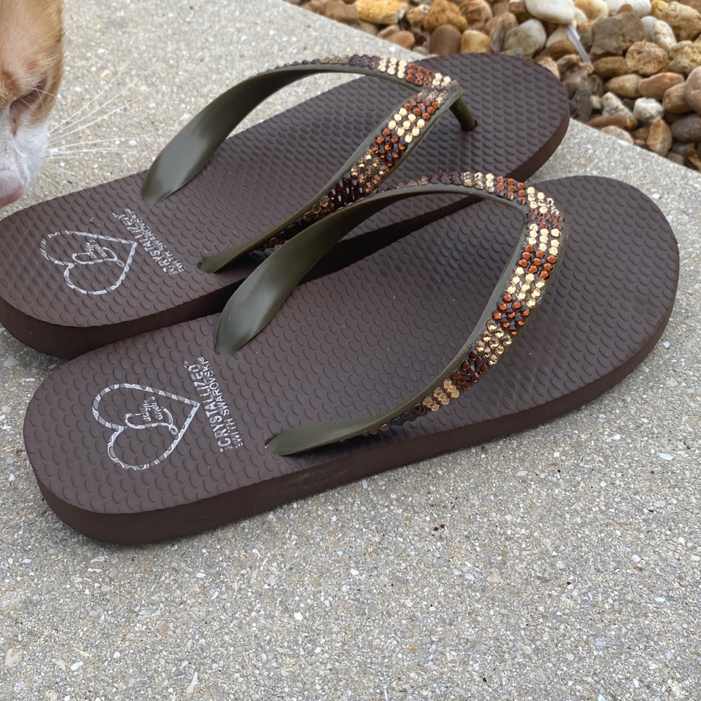 Flat beach sandal with Swarowski stones.